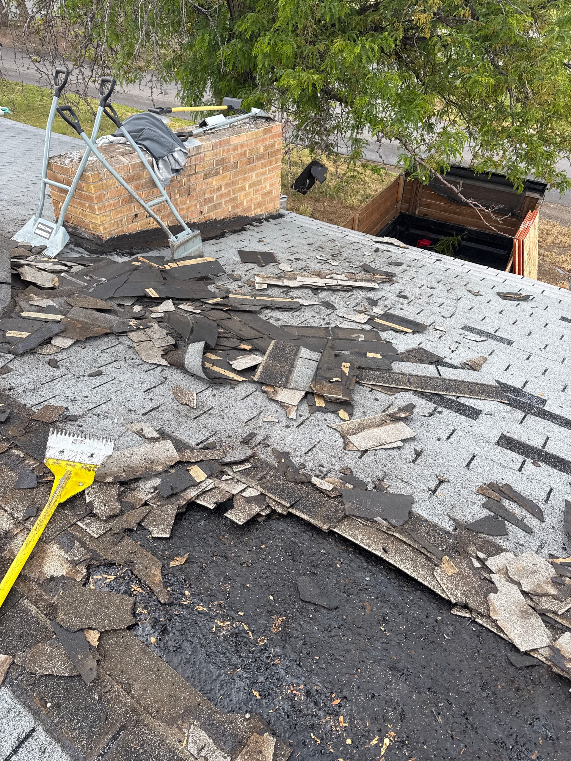 Worn-Out Shingles Stripped Down and Replaced Right image